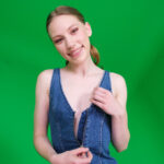 May Sinn revealing her young breasts.